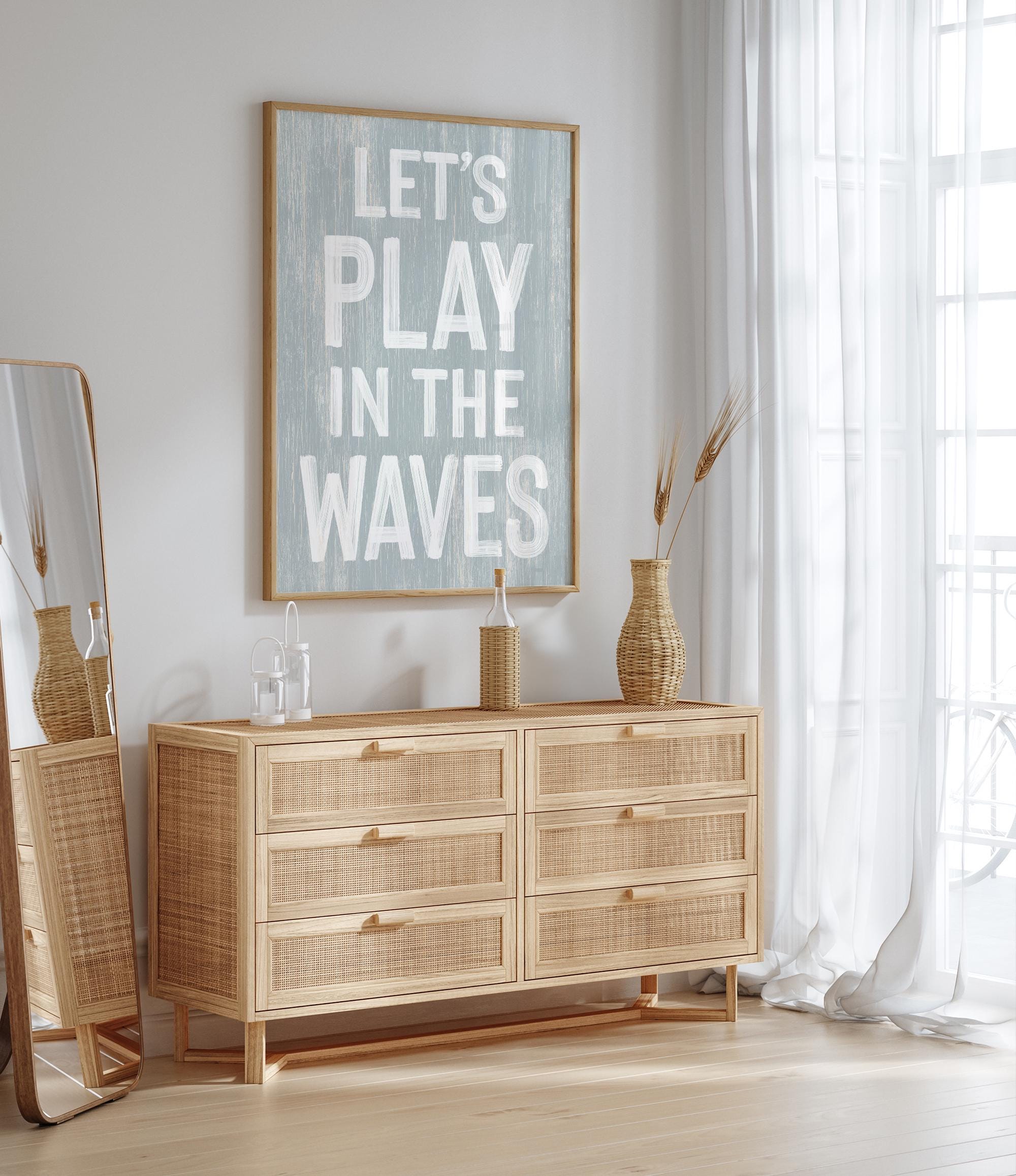 a picture of a room with a dresser and a mirror