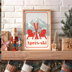 A framed poster of a snowy mountain landscape with a pair of skis and two red Adirondack chairs, placed on a wooden shelf above a collection of Christmas stockings.