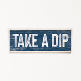 a wooden sign that says take a dip