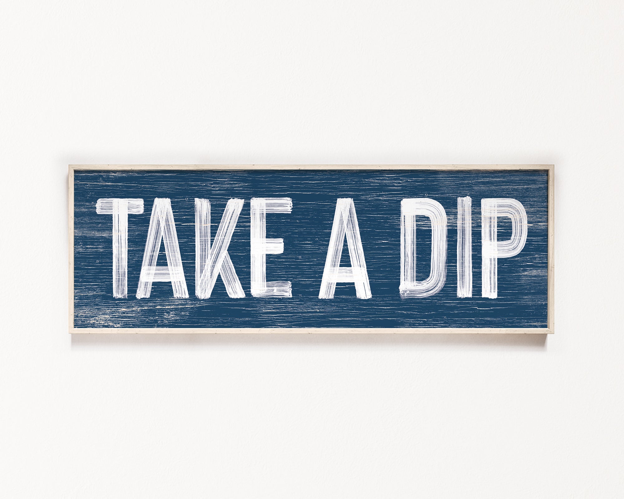 a wooden sign that says take a dip