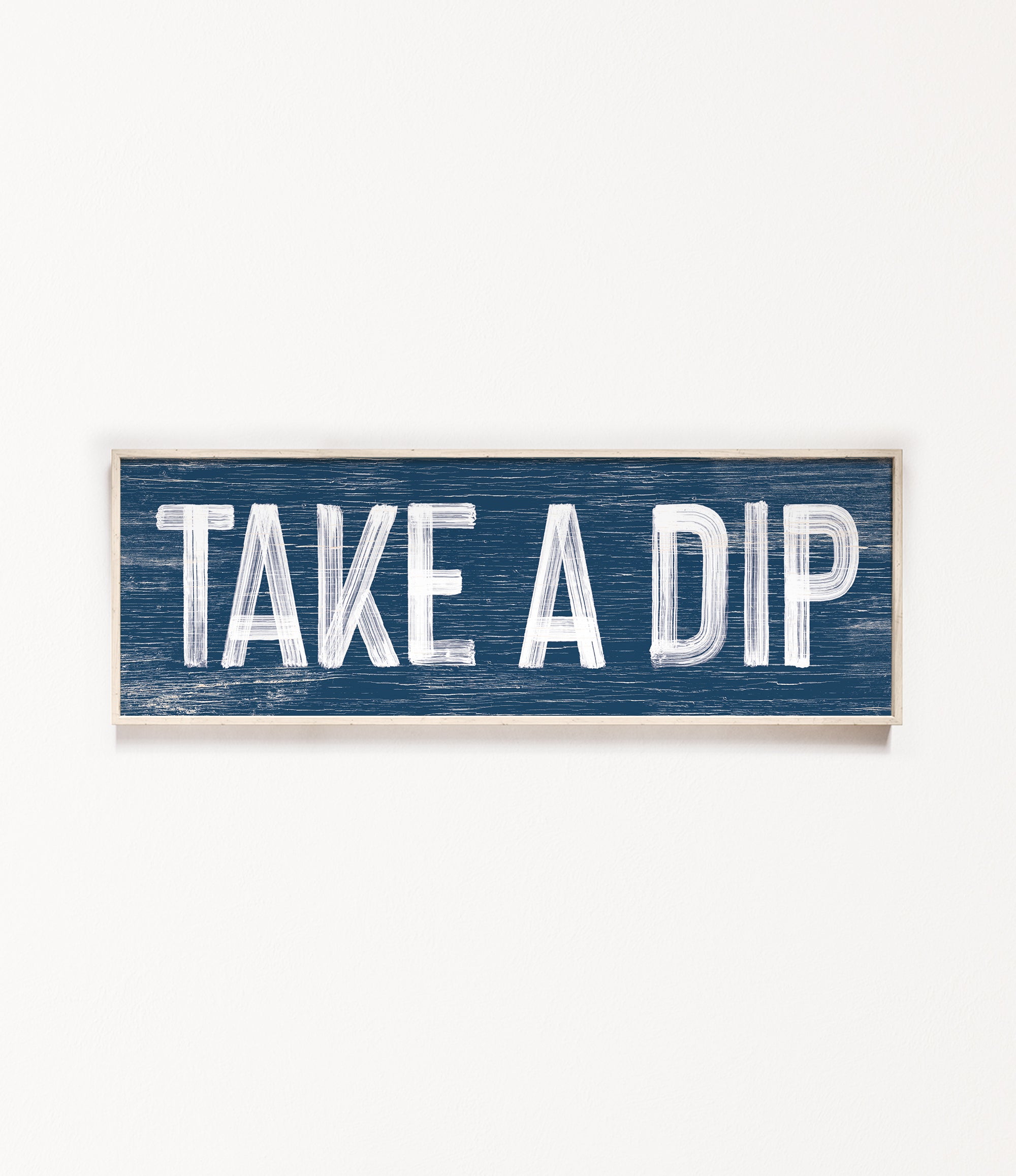 a wooden sign that says take a dip