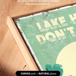 a framed print with a vintage-style design, including the text "I AM HAWK" and "DON'T T" on a green background.