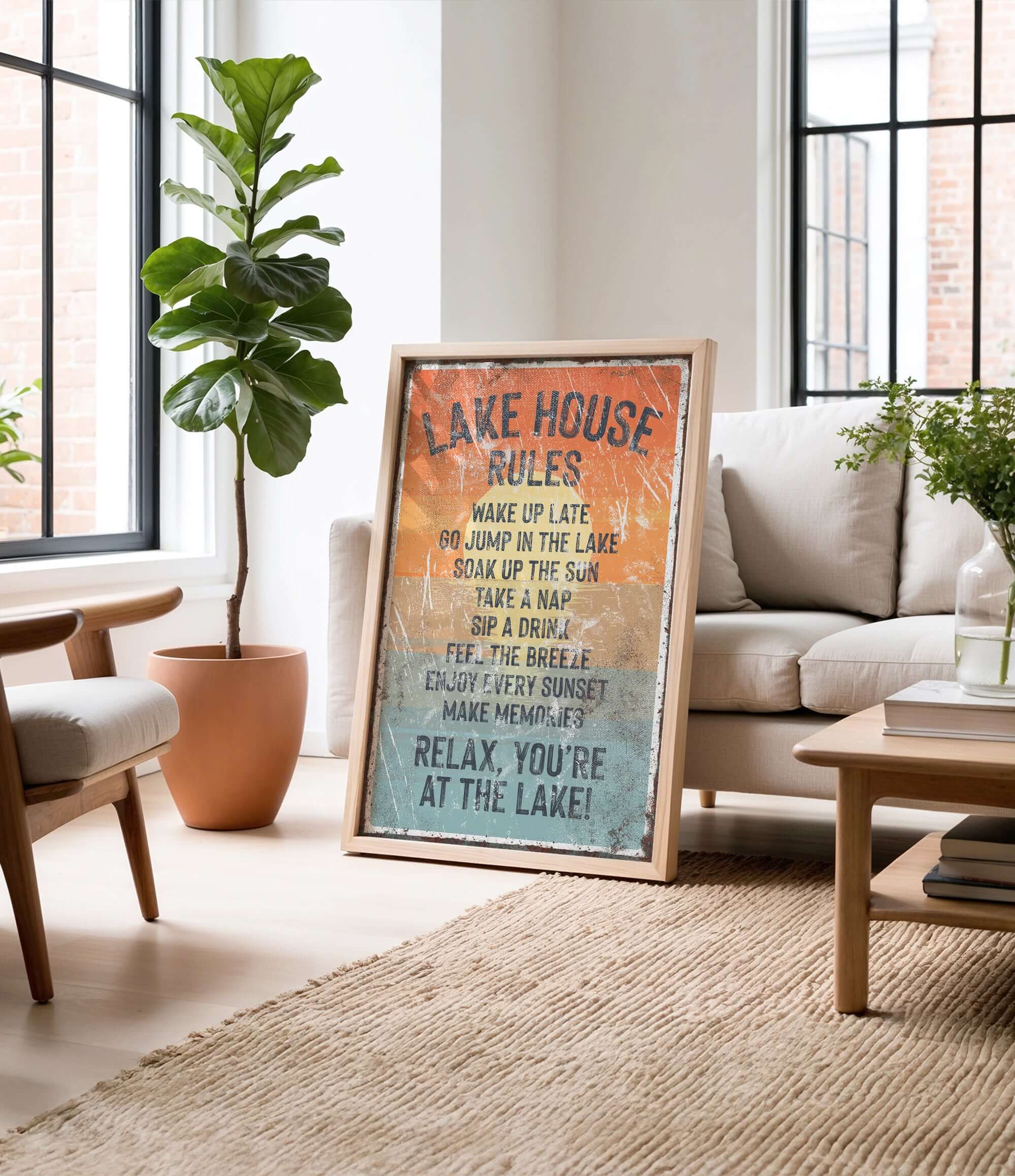 a framed sign with a list of rules for a lake house, including activities such as waking up late, jumping in the lake, taking a nap, drinking, and enjoying the sun.
