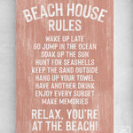 The Beach House Rules Sign, Painted Wood, Coral features beach house wall decor ideas like relaxing, waking up late, jumping in the ocean, and enjoying every sunset.