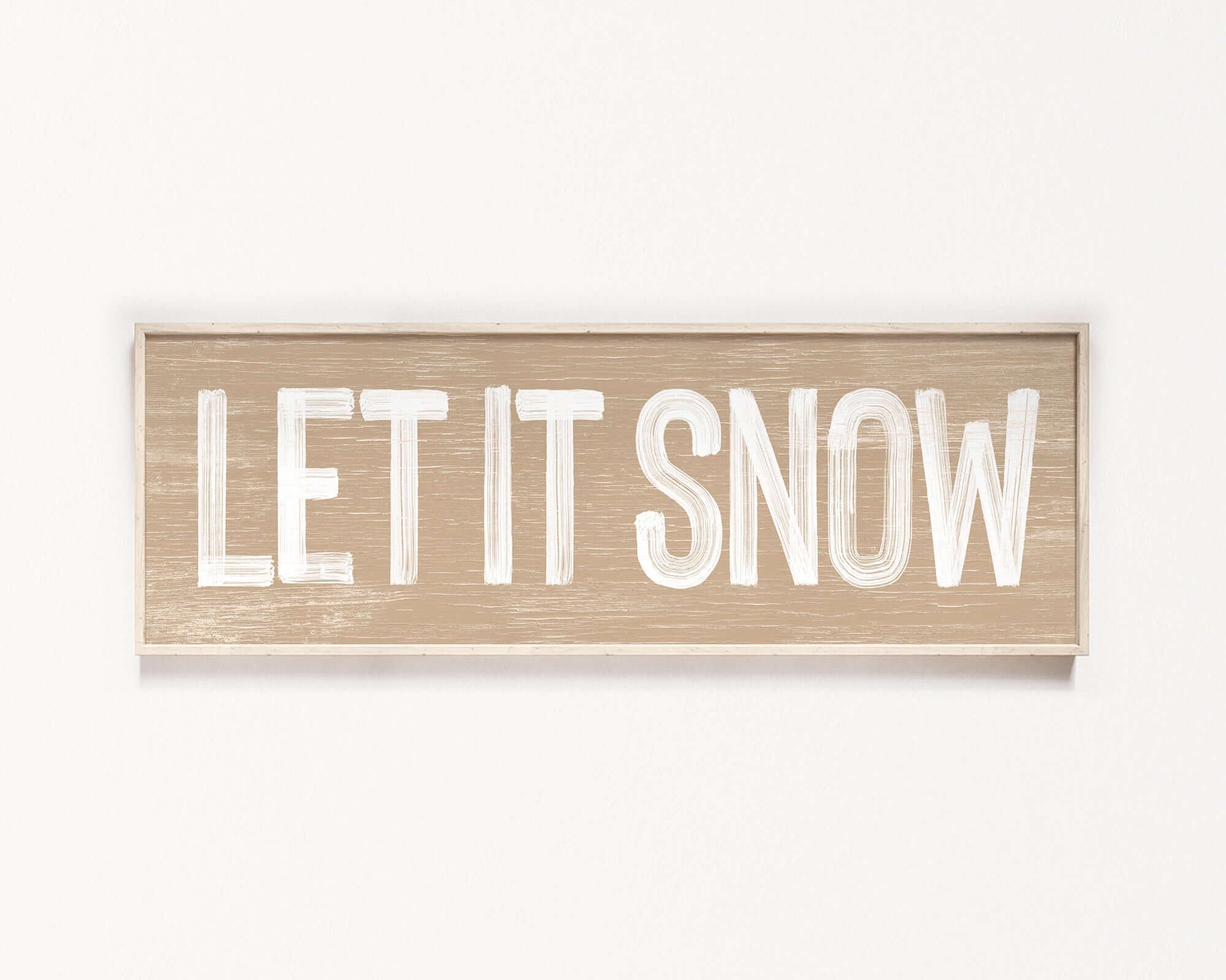 a wooden sign that says let it snow