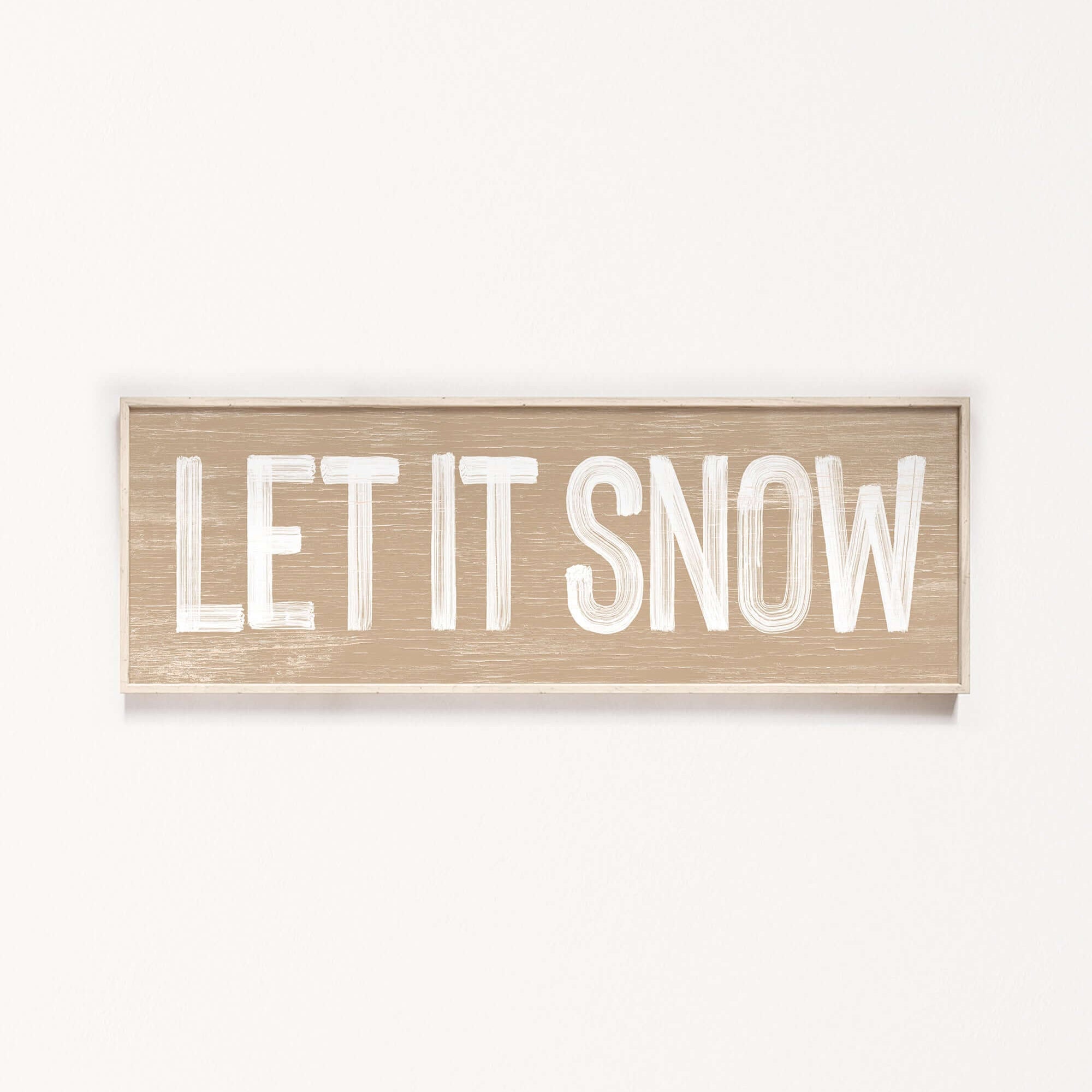 a wooden sign that says let it snow