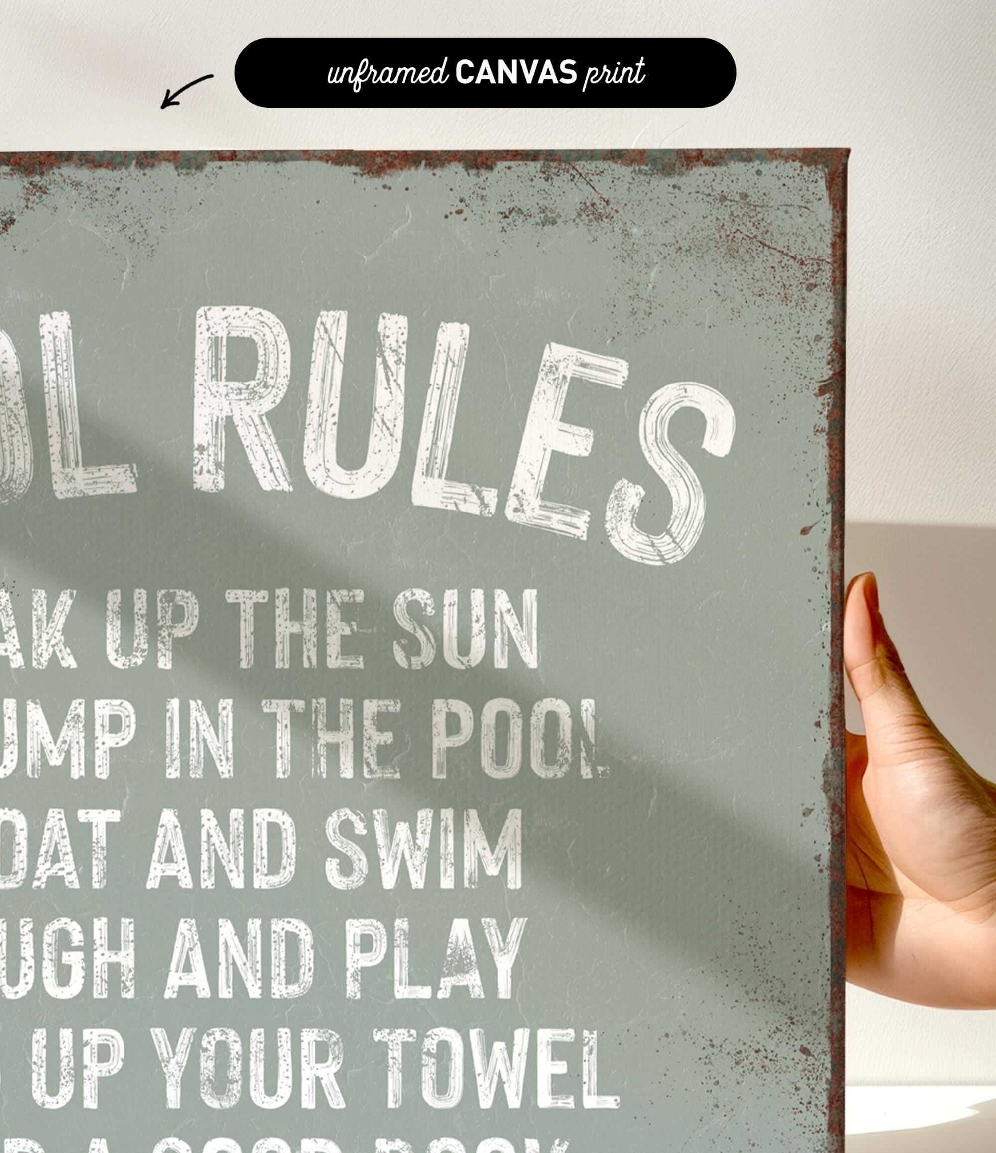 a hand holding a sign that says pool rules