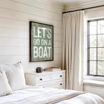a bedroom with a bed, dresser and window