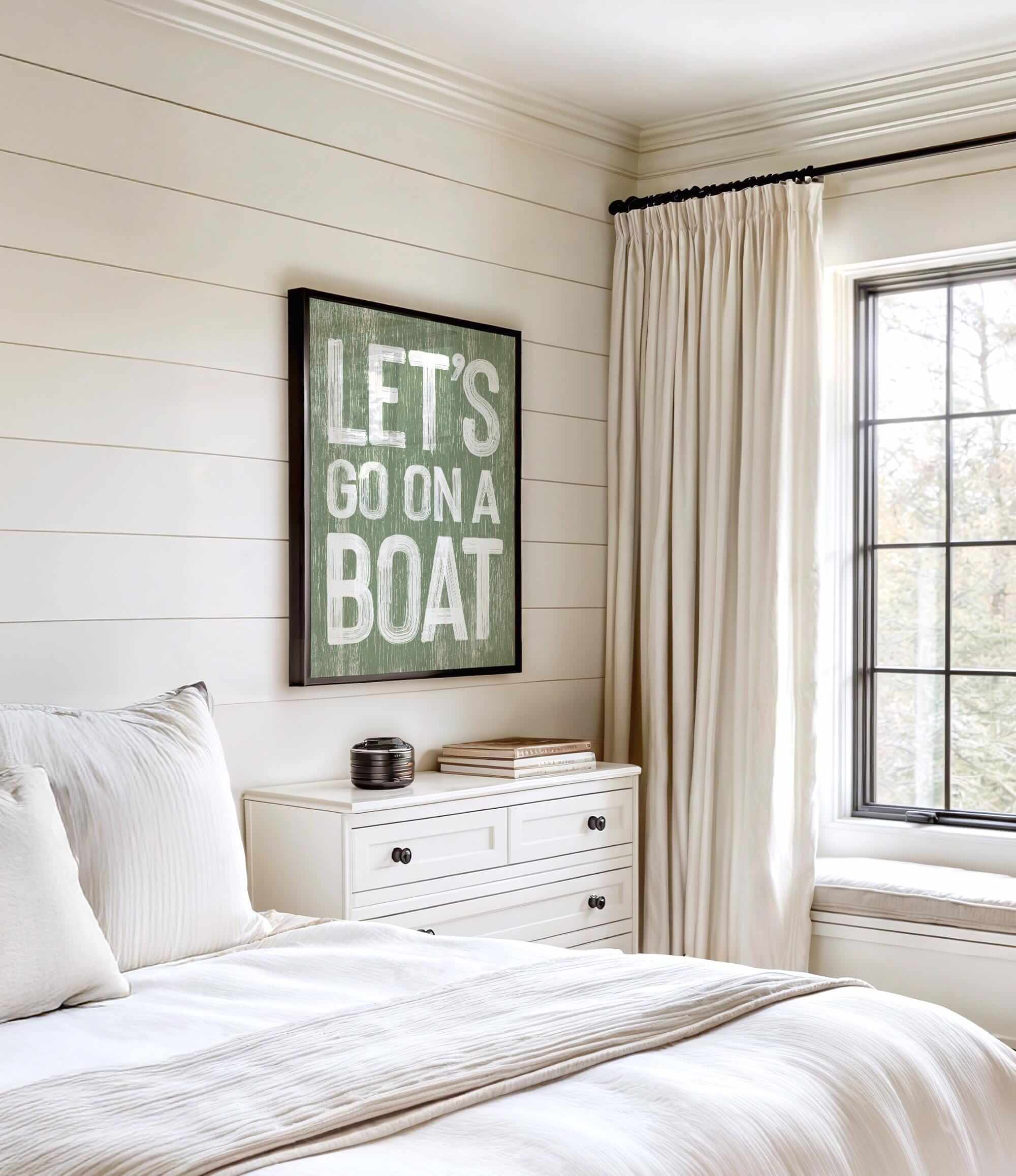 a bedroom with a bed, dresser and window