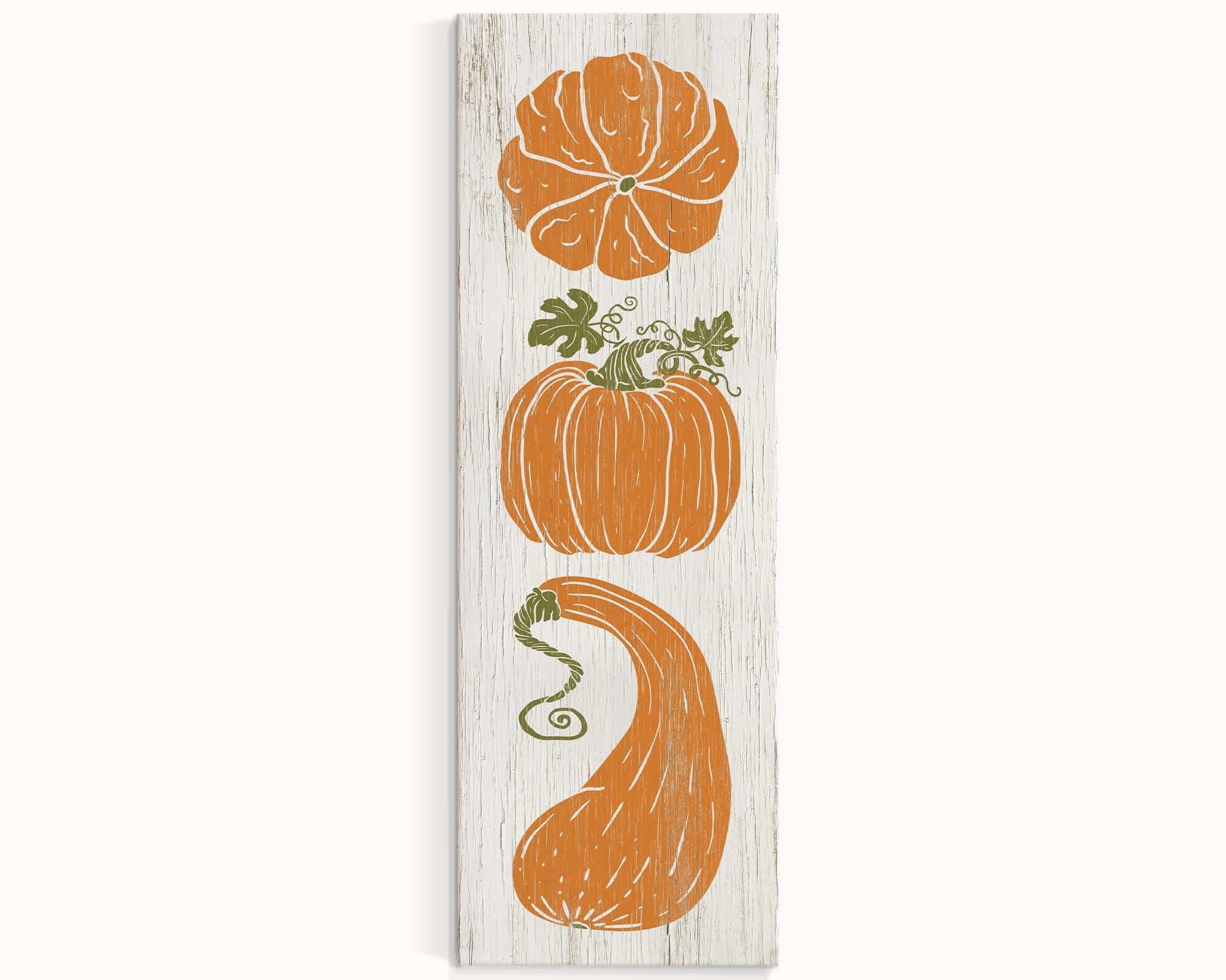 a wooden sign with three pumpkins on it