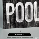 a black and white picture of a pool sign