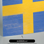 a wooden block with a flag painted on it
