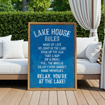 A blue sign with white text is displayed in front of a wooden deck with white cushions, and a white curtain is visible in the background.