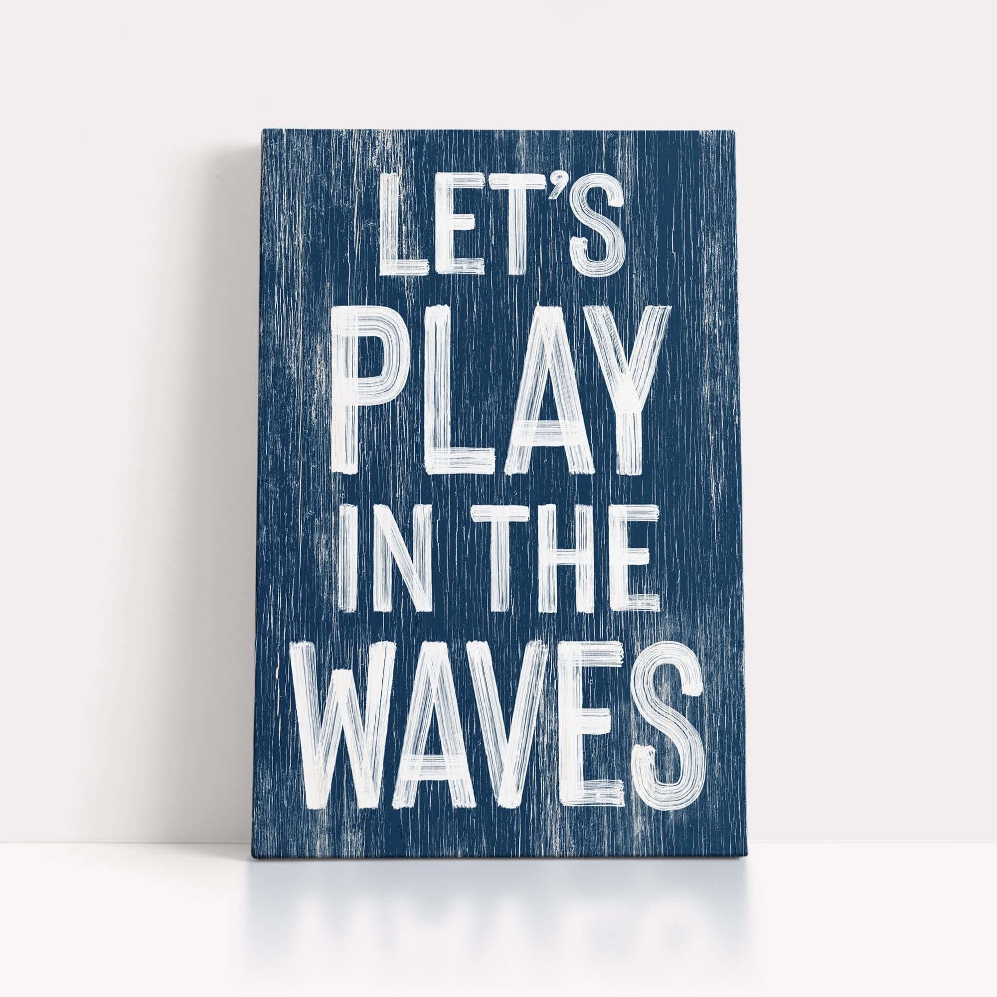 a wooden sign that says let's play in the waves