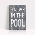 a sign that says go jump in the pool