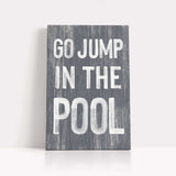 a sign that says go jump in the pool