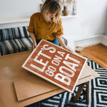 a woman holding a sign that says let&#39;s do what you want