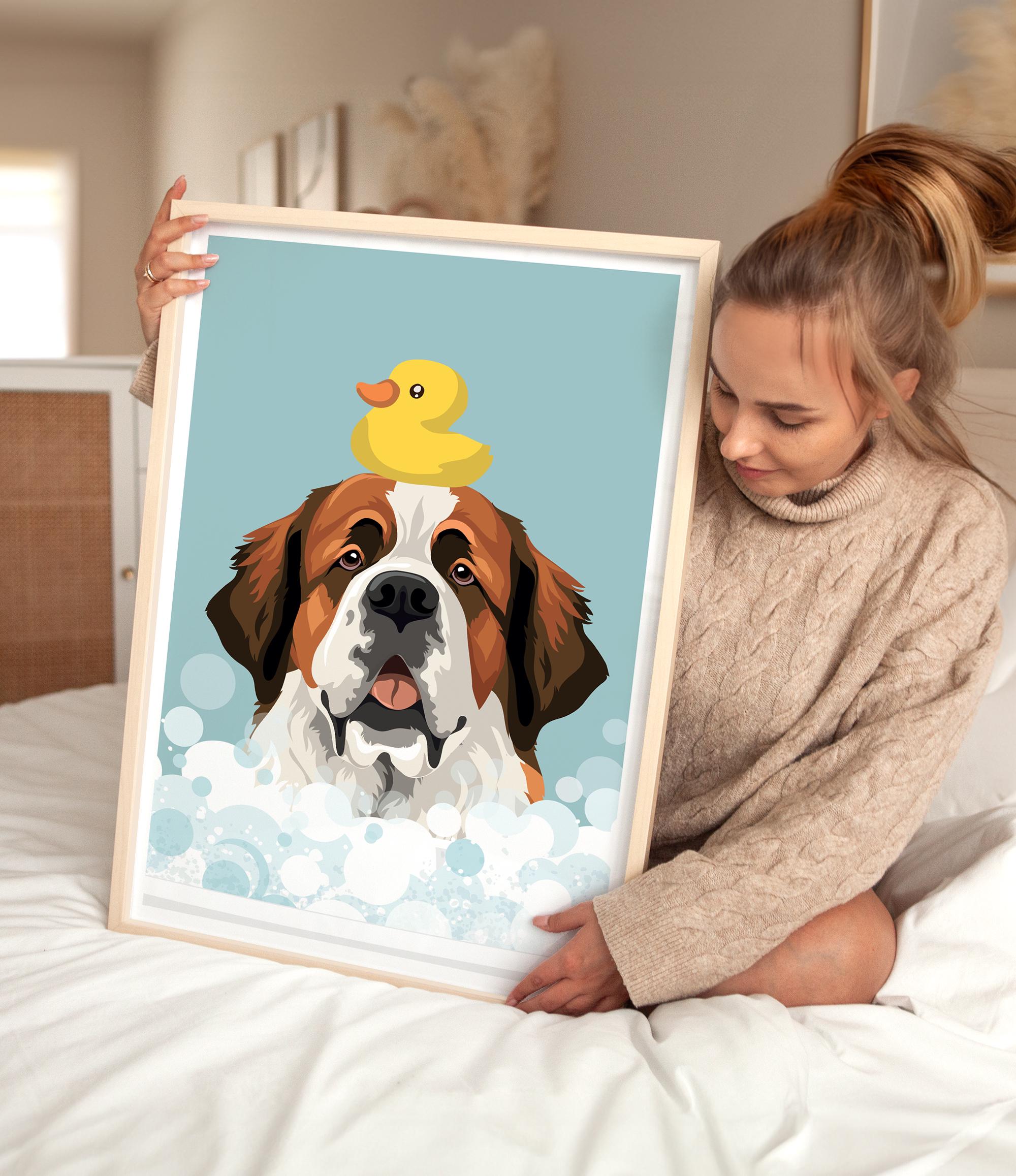 A woman is holding a framed picture of a dog with a yellow rubber duck on its head, which is sitting in a bubble of water.