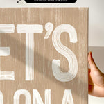 a person holding up a sign that says let&#39;s it&#39;s bona
