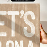 a person holding up a sign that says let&#39;s it&#39;s bona