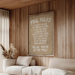 a living room with a white couch and a poster on the wall