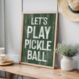 a wooden sign that says let's play pickle ball