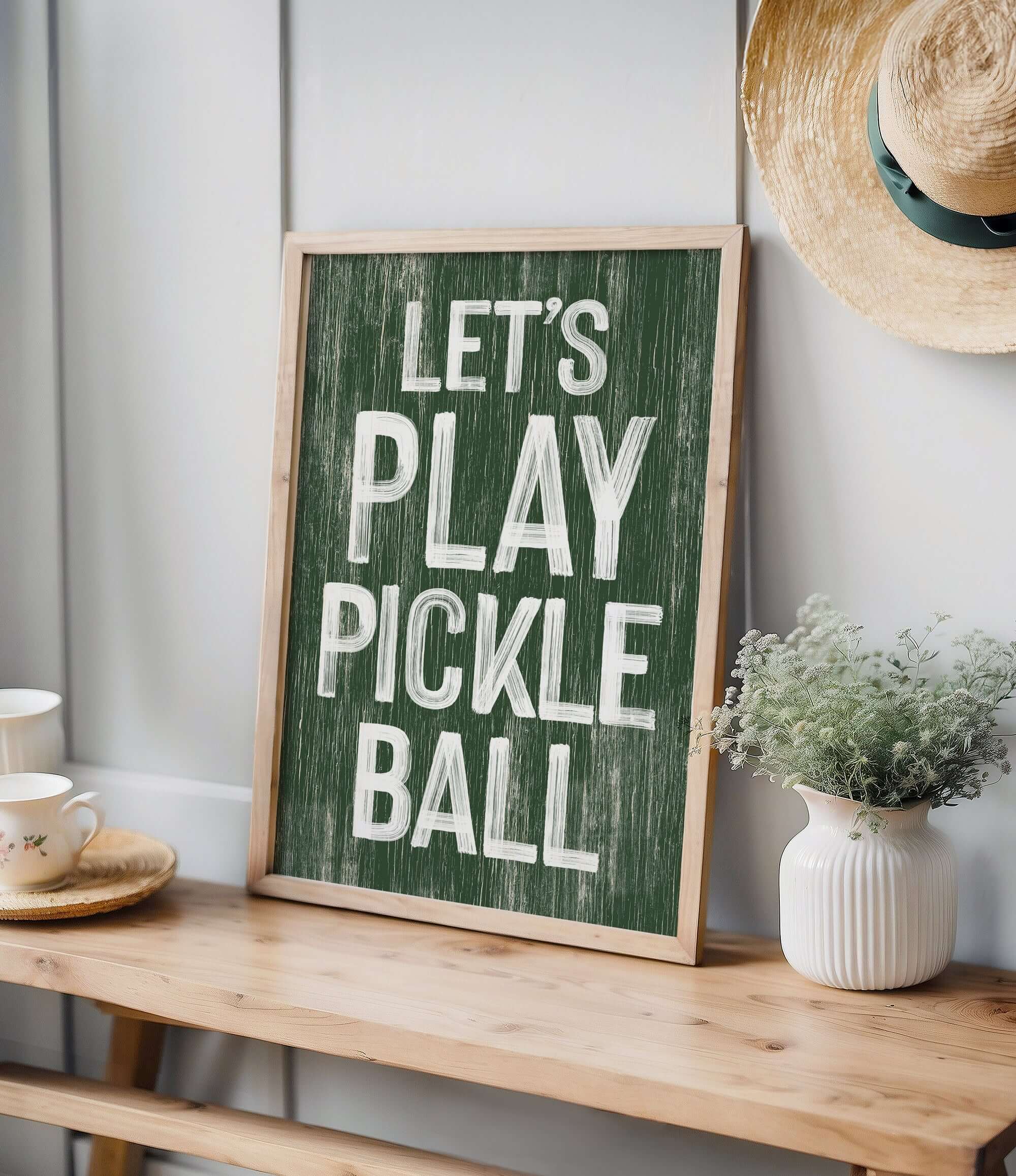 a wooden sign that says let's play pickle ball