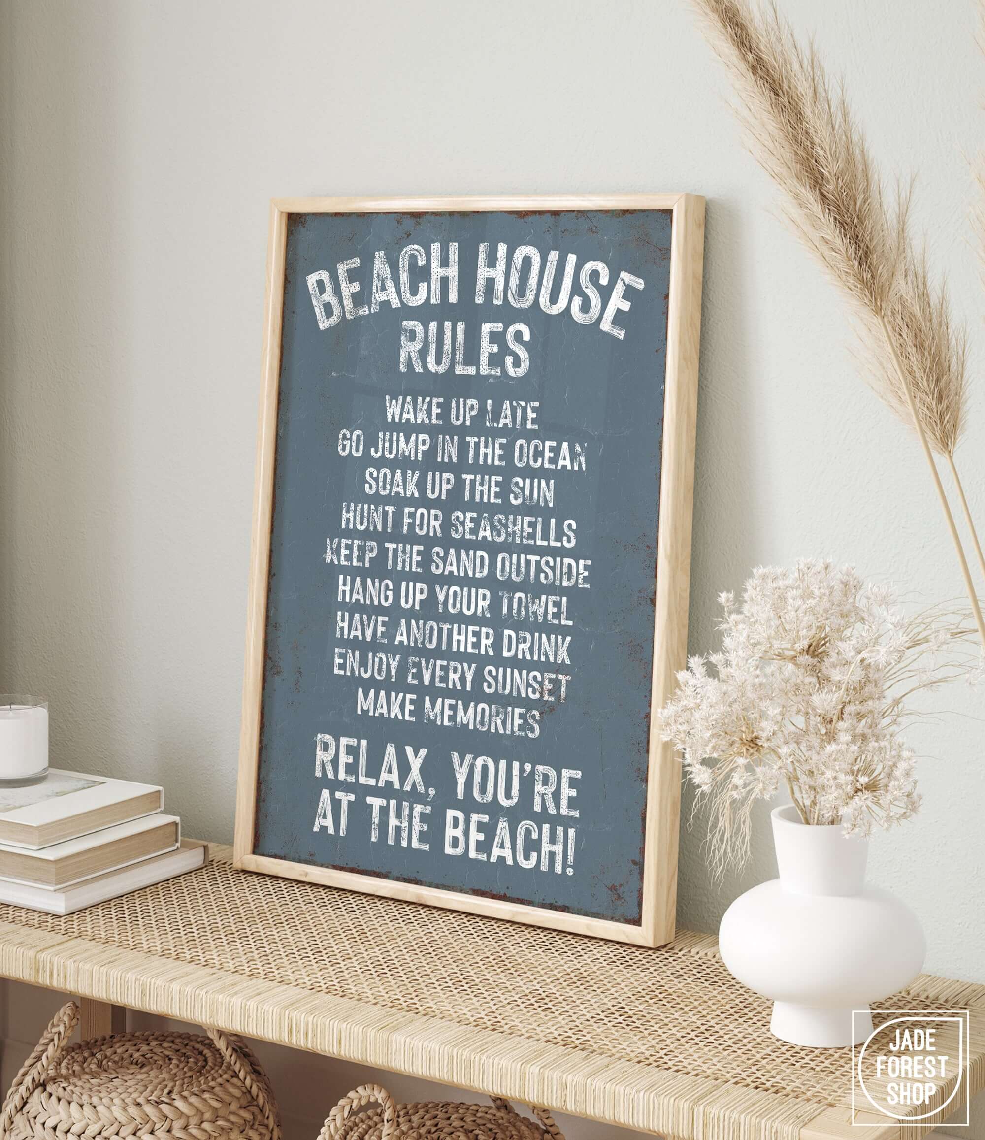 a picture of a beach house rules sign on a shelf