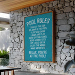 a pool rules sign on a stone wall