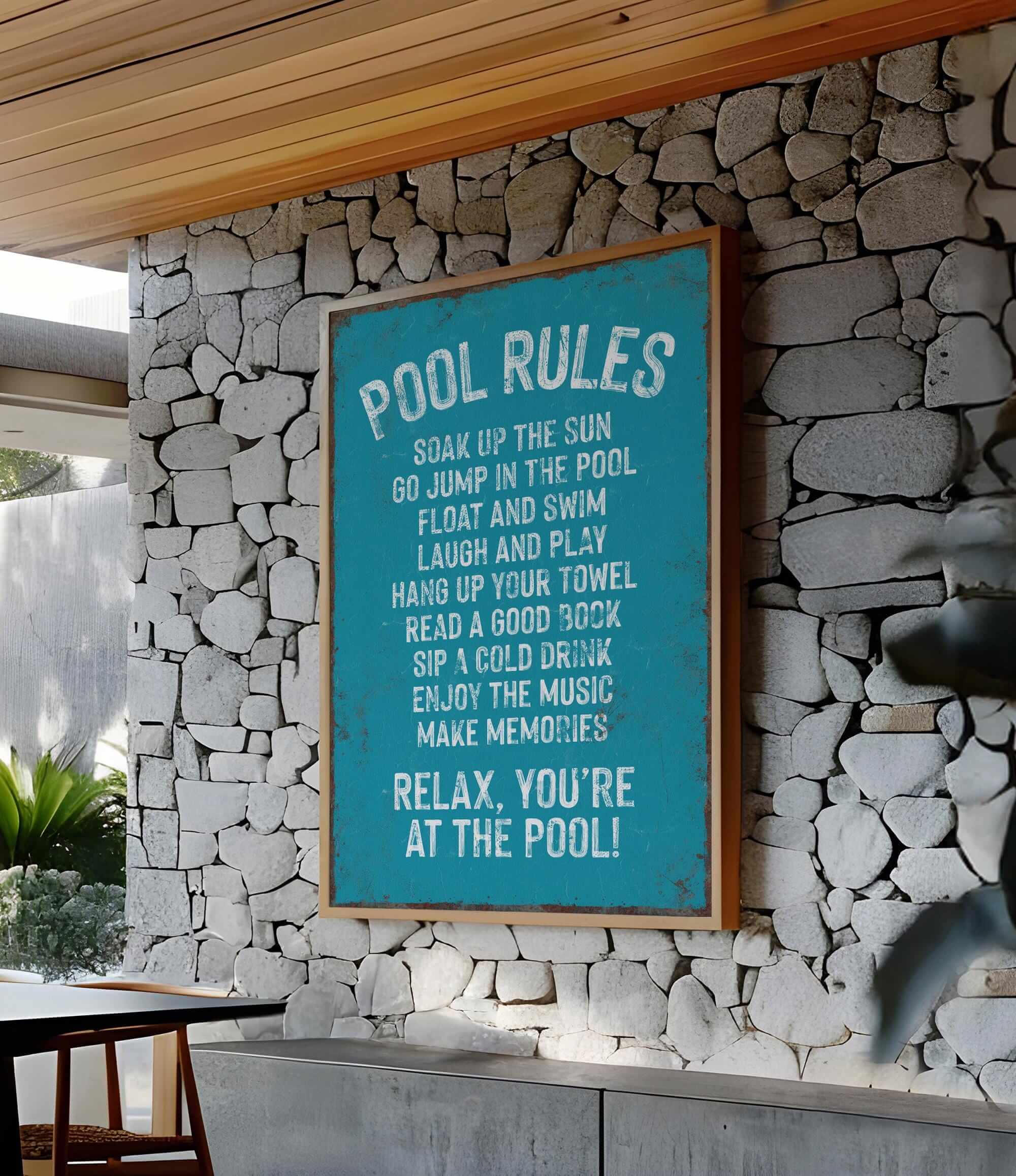 a pool rules sign on a stone wall
