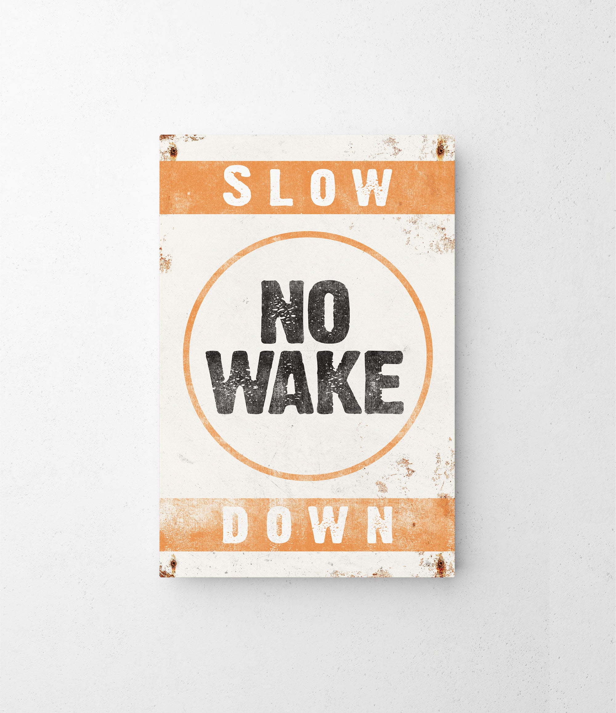 a sign that says slow no wake down