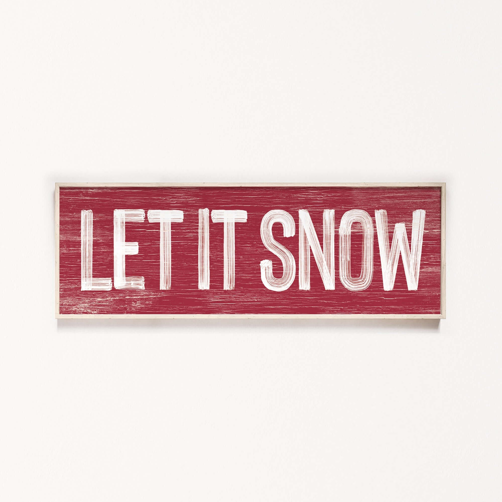 a wooden sign that says let it snow