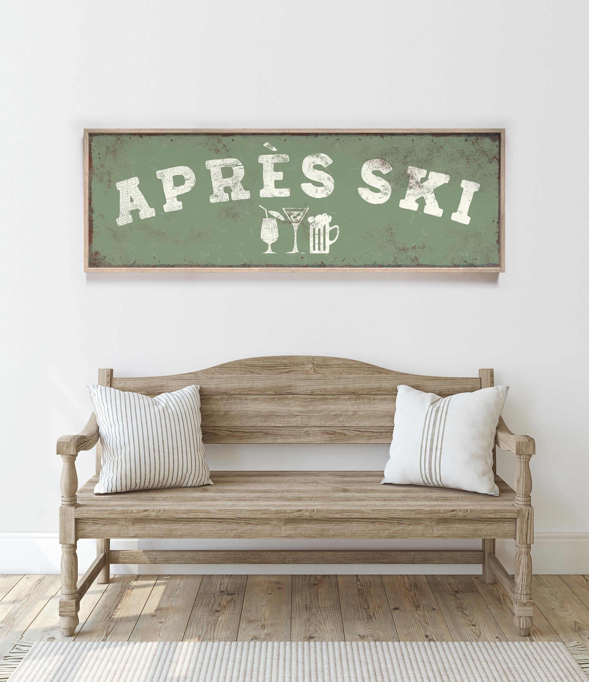 a wooden bench with two striped pillows, and above it is a framed sign with the text "APRÈS SKI" in white letters.