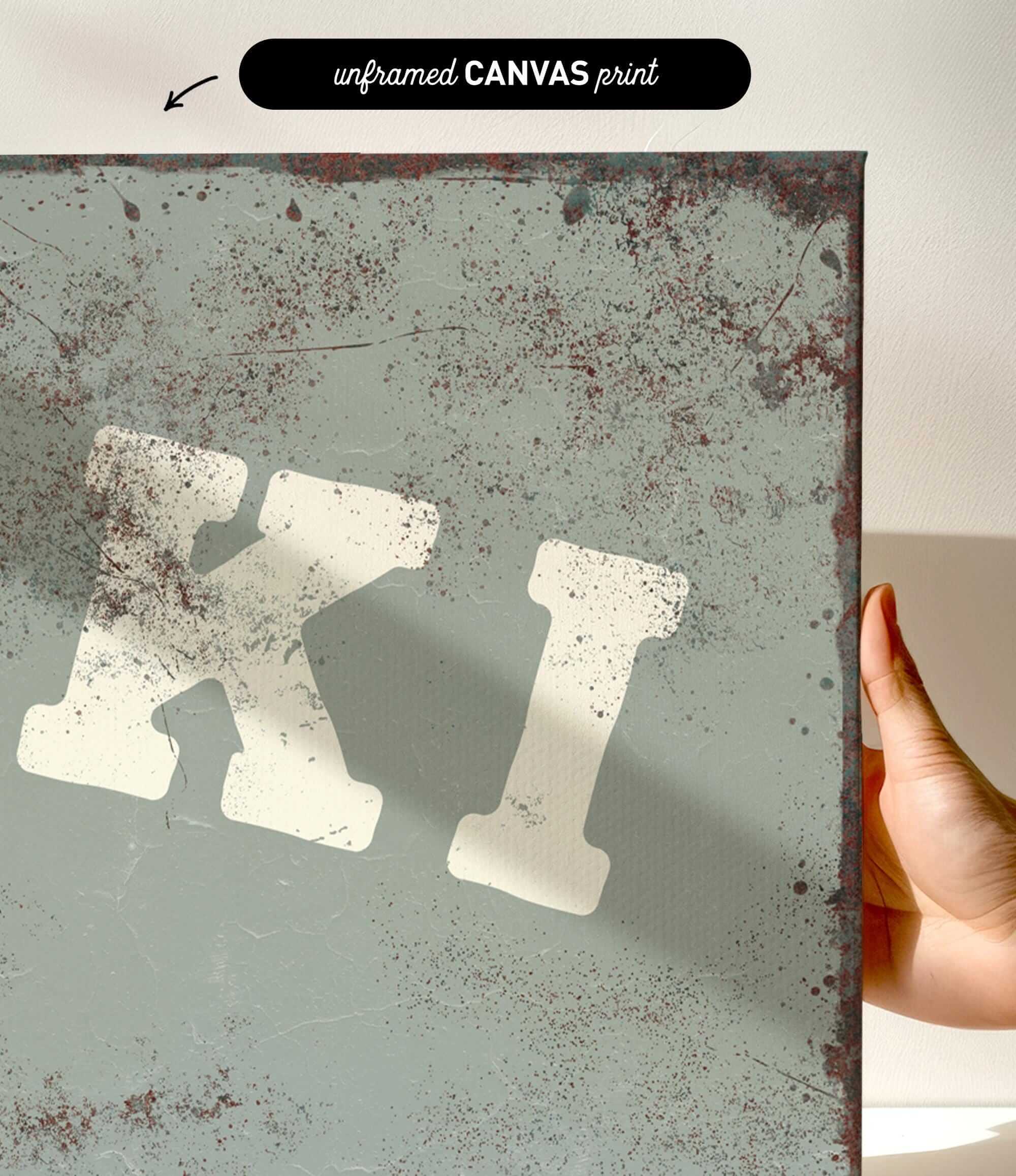 a close-up view of a textured, weathered surface with a large, bold, white letter "K" prominently displayed.