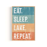 a wooden sign that says eat sleep lake repeat