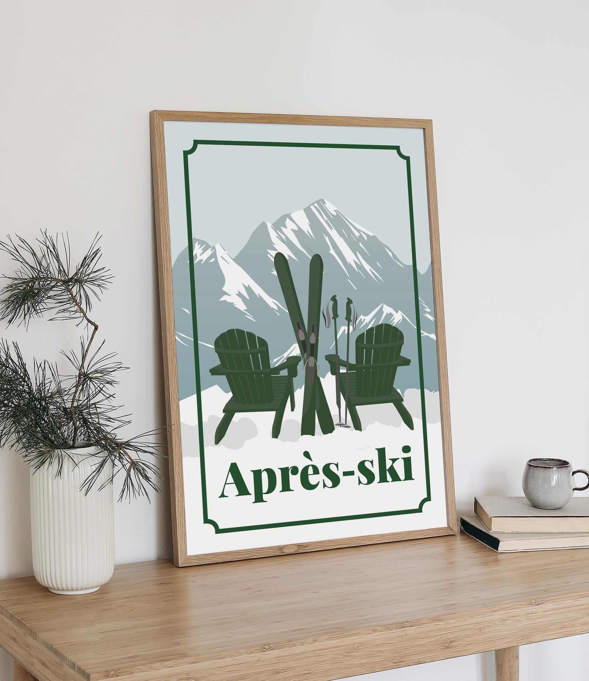 A framed poster with a mountain landscape and two green chairs, along with the text "Apres-skii" (Skiing) in the bottom right corner.
