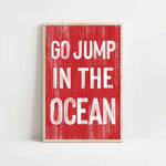 a red and white sign that says go jump in the ocean