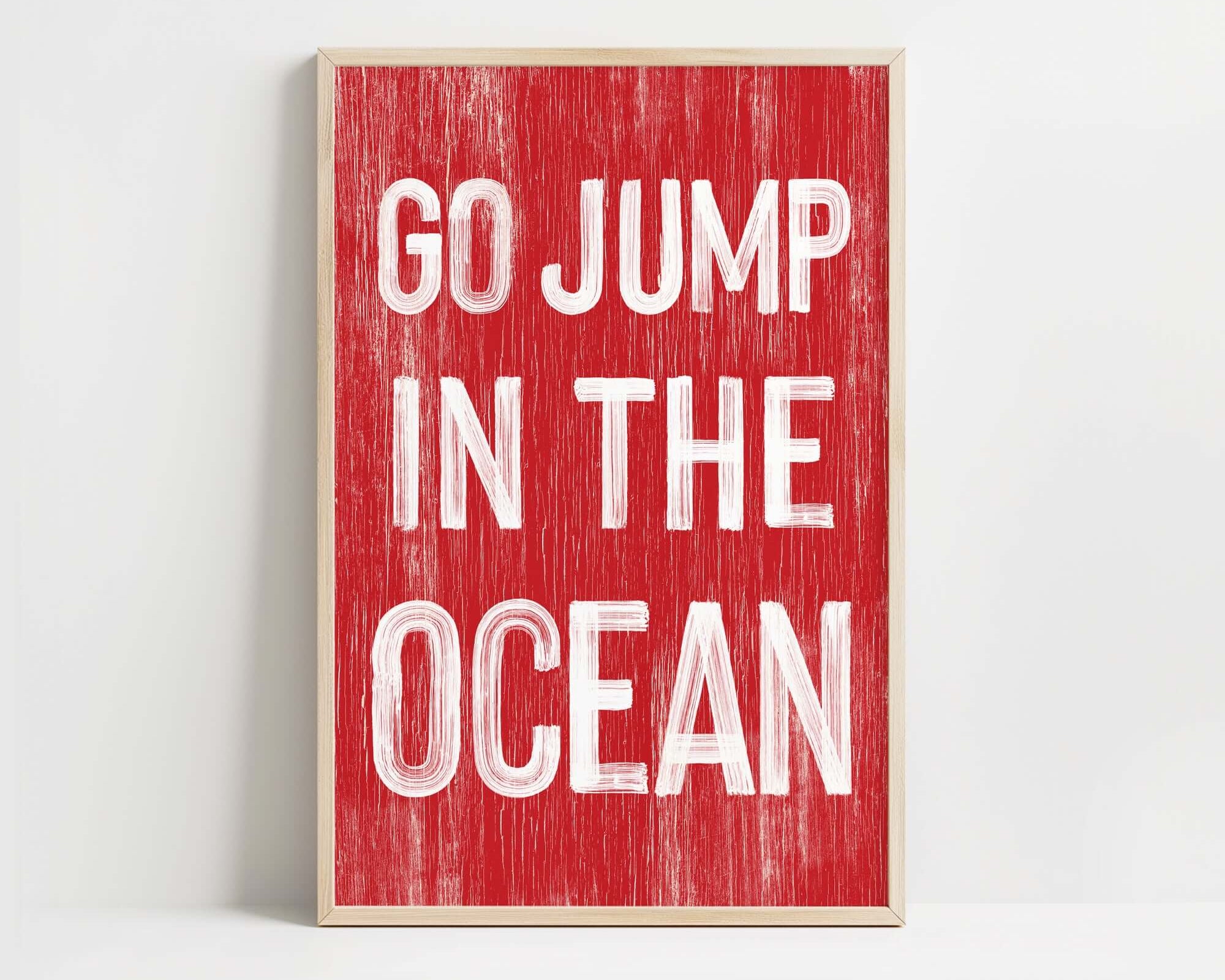 a red and white sign that says go jump in the ocean