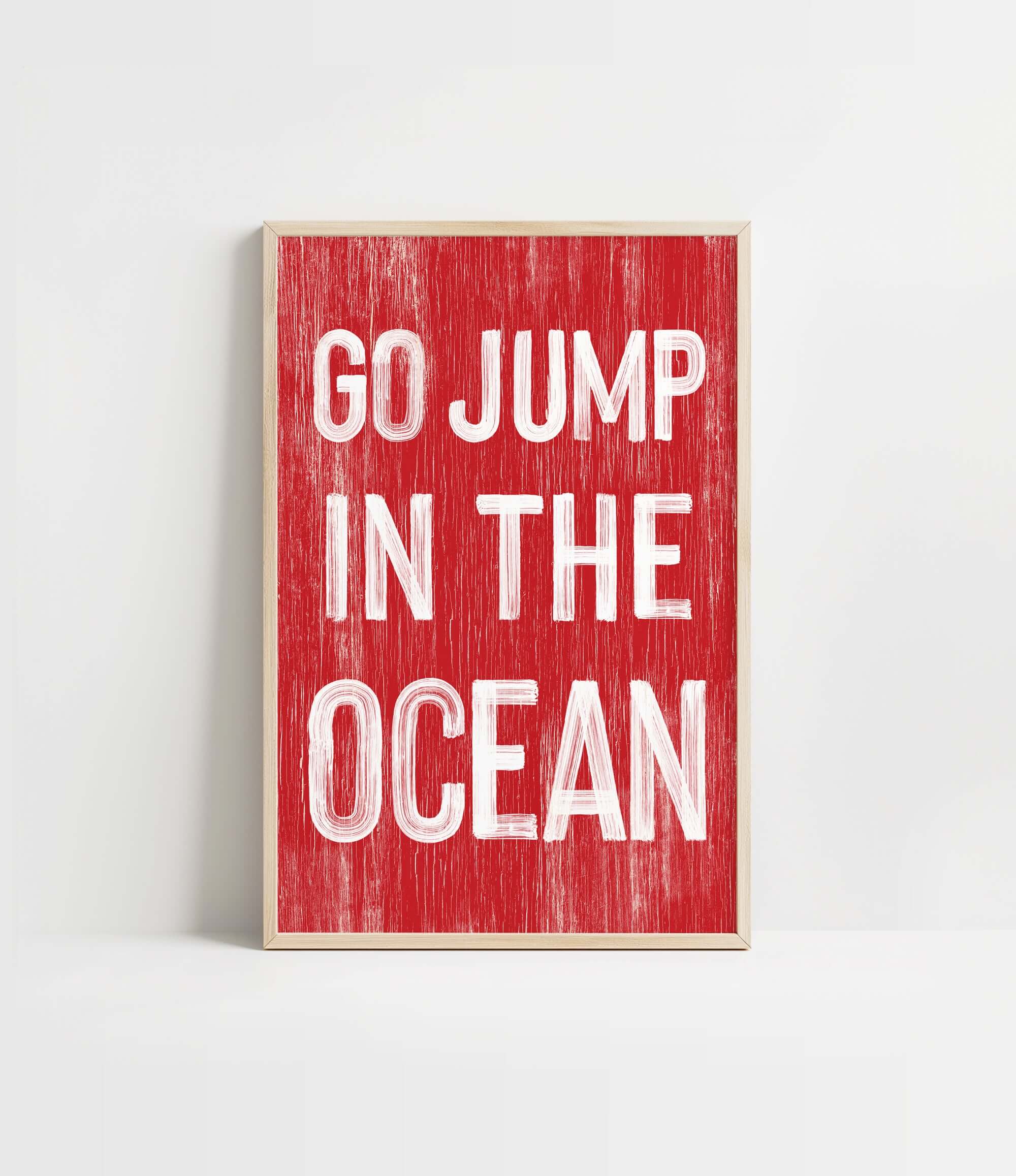 a red and white sign that says go jump in the ocean