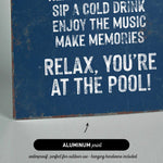 a sign that reads relax you&#39;re at the pool