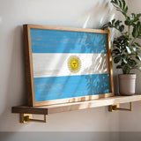a picture of the flag of argentina on a shelf