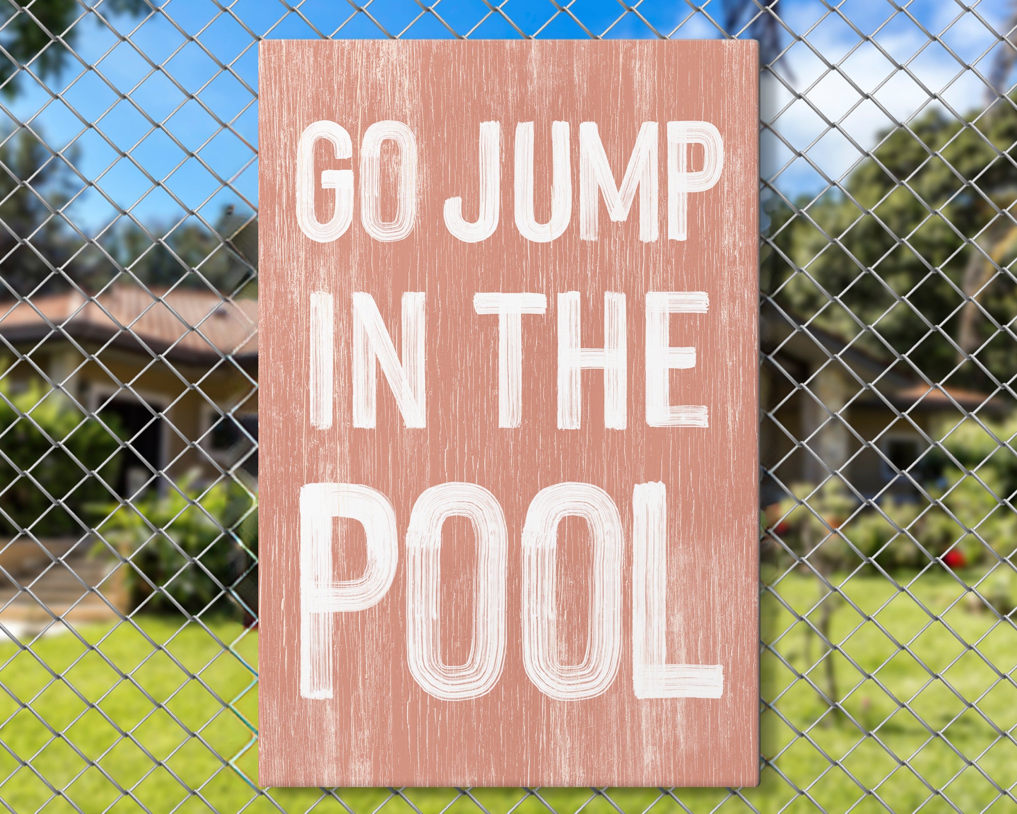 a sign on a fence that says go jump in the pool