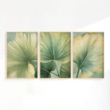 The image is a triptych of framed artworks featuring large, green leaves with intricate patterns.