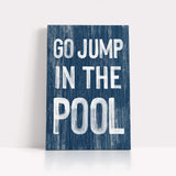 a wooden sign that says go jump in the pool