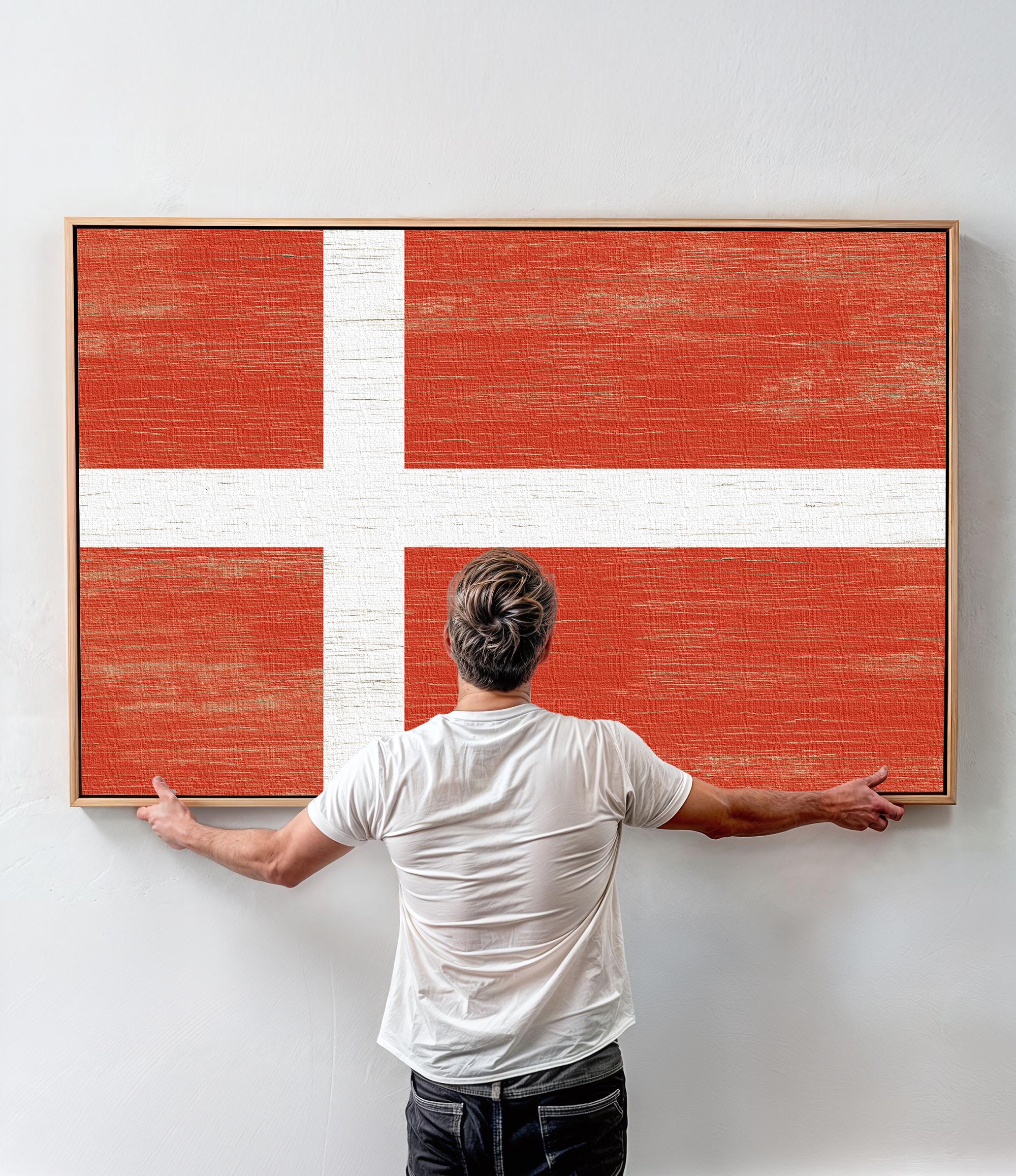 a man standing in front of a large flag