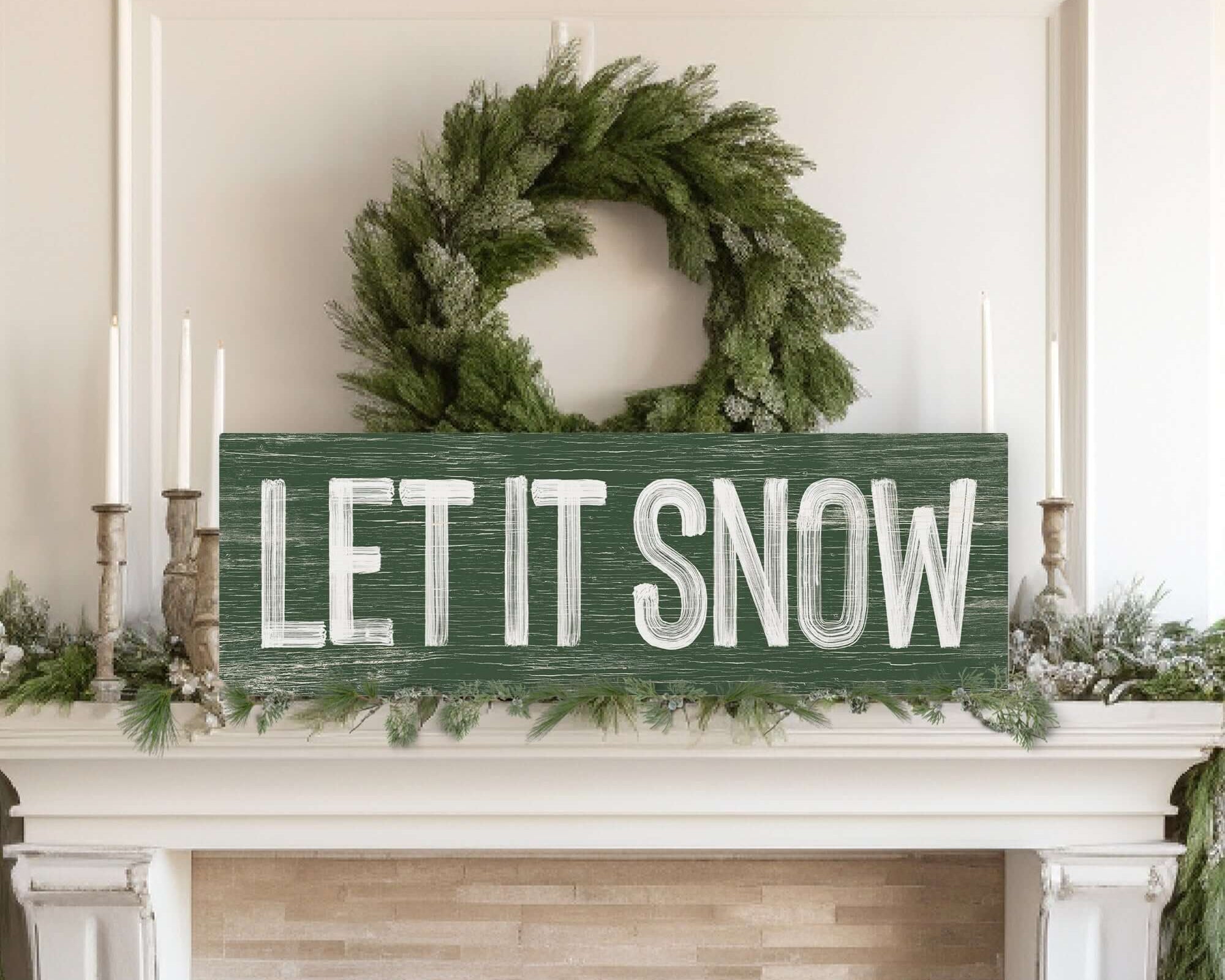 a fireplace with a sign that says let it snow