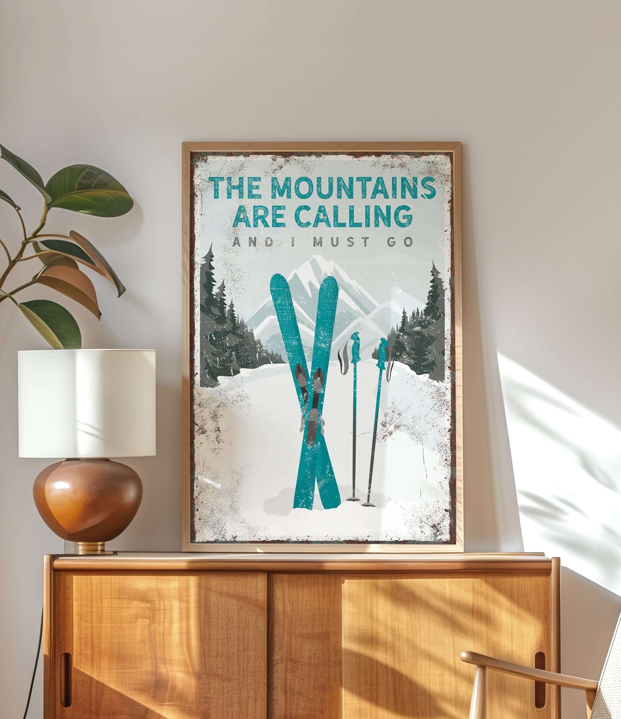 a poster of skis on a wall above a dresser