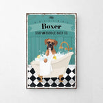 A vintage-style advertisement for a dog-themed bath product called "Boxer Soap and Bubble Bath Co." featuring a brown dog sitting in a bathtub filled with bubbles.