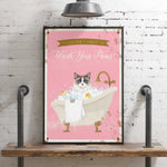 A framed poster with a cat sitting in a bathtub filled with bubbles, accompanied by the text "Please don't forget to wash your paws".