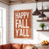 a cozy kitchen scene with a rustic wooden table, a potted plant, and a framed sign that reads "HAPPY FALL 'Y'ALL".